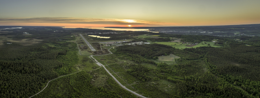 Drone image taken in the south from the runway with sunrise in Lake Vättern and over Jönköping